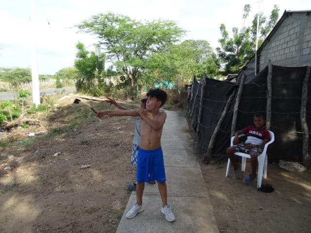 Kids in Colombia with homemade  slingshots. Used in the article wealthy affiliate review with the URL is wealthy affiliate worth the money?. 