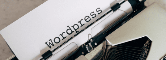 A page in a typewriter with the word WordPress, used in the article Wealthy Affiliate Review: is-wealthy-affiliate-worth-the-money 