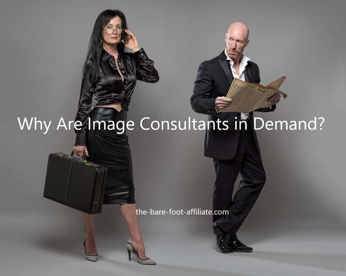 A woman dressed in dark business attire carrying a brief-case and talking on a mobile phone. and a guy dressed in a business suit without a tie, holding an open newspaper and looking at the woman. Used in the article Whay are Image consultants in Demand
