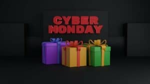 A Cyber Monday sign above some gift wrapped presents. Used in the article, How to make a niche website profitable. 